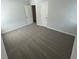 A bright bedroom features neutral walls and carpet with multiple access doors at 108 Deer Xing, Temple, GA 30179
