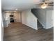Spacious living room with hardwood floors, recessed lighting, and an open concept layout leading into the kitchen at 108 Deer Xing, Temple, GA 30179