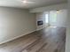 Open-concept living room features modern flooring, recessed lighting, and an electric fireplace at 108 Deer Xing, Temple, GA 30179