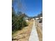 Street view showcasing a newly developed neighborhood with sidewalks and modern homes at 108 Deer Xing, Temple, GA 30179