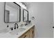 Stylish bathroom with double sink vanity, black hardware, and contemporary mirrors at 2508 Wagon Trce, Duluth, GA 30096