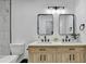 Modern bathroom featuring double sink vanity, wood cabinets, and black fixtures at 2508 Wagon Trce, Duluth, GA 30096