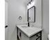 Modern bathroom vanity with marble countertop, black hardware, and stylish lighting at 2508 Wagon Trce, Duluth, GA 30096
