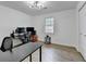 Bright bedroom with wood-look flooring and minimalist decor, offering a serene living space at 2508 Wagon Trce, Duluth, GA 30096