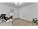 Modern bedroom with wood-look flooring and minimalist decor, offering a serene living space at 2508 Wagon Trce, Duluth, GA 30096