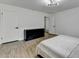 Bright bedroom featuring wood-look floors, modern lighting and ample storage at 2508 Wagon Trce, Duluth, GA 30096