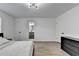 Bright bedroom featuring wood-look floors and a view to the bathroom at 2508 Wagon Trce, Duluth, GA 30096