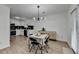 Bright dining area connected to a modern kitchen with stainless steel appliances and a large window at 2508 Wagon Trce, Duluth, GA 30096