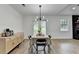Eat-in kitchen with view of the living room, a stone fireplace, and backyard at 2508 Wagon Trce, Duluth, GA 30096