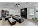 Modern living room featuring a fireplace, ceiling fan, and an open floor plan at 2508 Wagon Trce, Duluth, GA 30096