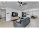 Modern living room with an open layout, sleek furniture, and a dining area in the background at 2508 Wagon Trce, Duluth, GA 30096