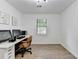 Bright office space with wood-look floors, a window, and a neutral color palette at 2508 Wagon Trce, Duluth, GA 30096