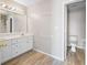 Bright bathroom featuring a double sink vanity with white cabinetry and a large mirror at 260 Manning Sw Rd # 76, Marietta, GA 30064