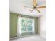 Bedroom with neutral carpet, light green walls, and a large window with natural light at 260 Manning Sw Rd # 76, Marietta, GA 30064
