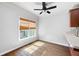 Bright dining area with wood floors, neutral walls, and a window with bamboo blinds at 260 Manning Sw Rd # 76, Marietta, GA 30064
