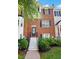 Brick townhome with steps leading to the front door and manicured landscaping at 260 Manning Sw Rd # 76, Marietta, GA 30064