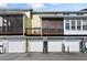 Back exterior of home with attached garages and screened porches at 260 Manning Sw Rd # 76, Marietta, GA 30064