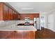 Well-lit kitchen features stainless steel appliances, wooden cabinetry, and an open entrance at 260 Manning Sw Rd # 76, Marietta, GA 30064