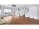Open floor plan showcasing hardwood floors and a staircase with white railings at 260 Manning Sw Rd # 76, Marietta, GA 30064