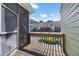 Screened-in porch with railing and view of neighboring townhomes at 260 Manning Sw Rd # 76, Marietta, GA 30064
