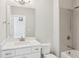 Bathroom with a bathtub and shower combination with a large mirror over the vanity at 3332 Old Concord Se Rd, Smyrna, GA 30082