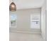 A bedroom with plush carpet, a rattan style light fixture, and natural light from two windows at 3332 Old Concord Se Rd, Smyrna, GA 30082