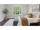 Bedroom with neutral decor, window views, and accent furniture at 3332 Old Concord Se Rd, Smyrna, GA 30082