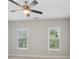 A bedroom featuring a ceiling fan, recessed lighting, and two windows providing ample natural light at 3332 Old Concord Se Rd, Smyrna, GA 30082