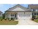 Charming one-story home featuring a two-car garage, covered porch, and manicured lawn in a residential neighborhood at 3332 Old Concord Se Rd, Smyrna, GA 30082