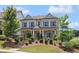 Charming two-story home with blue shutters, landscaped front yard, and inviting curb appeal at 3332 Old Concord Se Rd, Smyrna, GA 30082