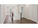 A well-lit upstairs hallway with hardwood floors, white wainscoting and classic lighting fixture at 3332 Old Concord Se Rd, Smyrna, GA 30082