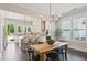 Bright, open kitchen with white cabinets, a center island with seating, and stainless steel appliances at 3332 Old Concord Se Rd, Smyrna, GA 30082