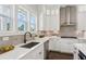 Modern kitchen with stone backsplash, stainless appliances, and natural light at 3332 Old Concord Se Rd, Smyrna, GA 30082