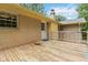 Back deck view showcases access door, steps down to backyard, and privacy railing at 574 Horseshoe Sw Cir, Lilburn, GA 30047