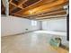 Spacious basement with exposed ceiling beams, concrete floors, and a small window at 574 Horseshoe Sw Cir, Lilburn, GA 30047