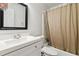 Bathroom featuring tile shower and white sink at 574 Horseshoe Sw Cir, Lilburn, GA 30047