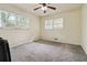 Bedroom featuring a ceiling fan and windows at 574 Horseshoe Sw Cir, Lilburn, GA 30047