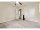 Bedroom with gray carpet, ceiling fan and neutral walls at 574 Horseshoe Sw Cir, Lilburn, GA 30047