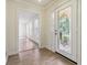 Bright foyer featuring hardwood floors and a decorative glass front door, leading into a spacious home at 574 Horseshoe Sw Cir, Lilburn, GA 30047