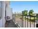 Balcony featuring an outdoor table and chairs overlooking a landscaped area and street view at 988 Viney Nw Way, Atlanta, GA 30318