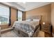 Cozy bedroom with a large bed featuring drawer storage and neutral tones, with large windows for natural light at 988 Viney Nw Way, Atlanta, GA 30318