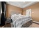 Comfortable bedroom featuring neutral paint, large bed, with side table and views to the attached bathroom at 988 Viney Nw Way, Atlanta, GA 30318