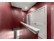 Stylish hallway on the second level features a bold, dark red wall color at 988 Viney Nw Way, Atlanta, GA 30318