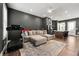 Spacious living room features a comfortable sectional sofa and a sleek kitchen area at 988 Viney Nw Way, Atlanta, GA 30318