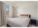 Cozy bedroom with natural light from windows, comfortable bed, and a modern nightstand at 2673 Caruso Way, Atlanta, GA 30339
