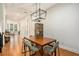Elegant dining room with dark wood table, modern chandelier and hardwood floors at 2673 Caruso Way, Atlanta, GA 30339