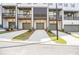 Townhome garages and driveways, offering ample parking space and curb appeal at 2673 Caruso Way, Atlanta, GA 30339