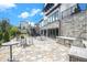 Outdoor patio area with seating and stone grill, perfect for entertaining and relaxation at 2673 Caruso Way, Atlanta, GA 30339