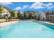 Large community swimming pool with lounge chairs for relaxation on a sunny day at 2673 Caruso Way, Atlanta, GA 30339