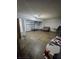 Spacious basement with concrete floors, a garage door, and ample storage space at 7073 Stonecreek Dr, Douglasville, GA 30134